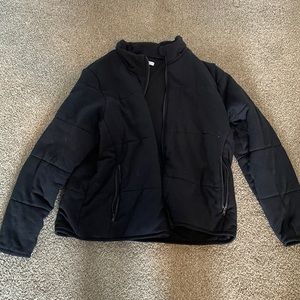 Black cotton puffy jacket. NOT WATER PROOF. Great for cold weather.